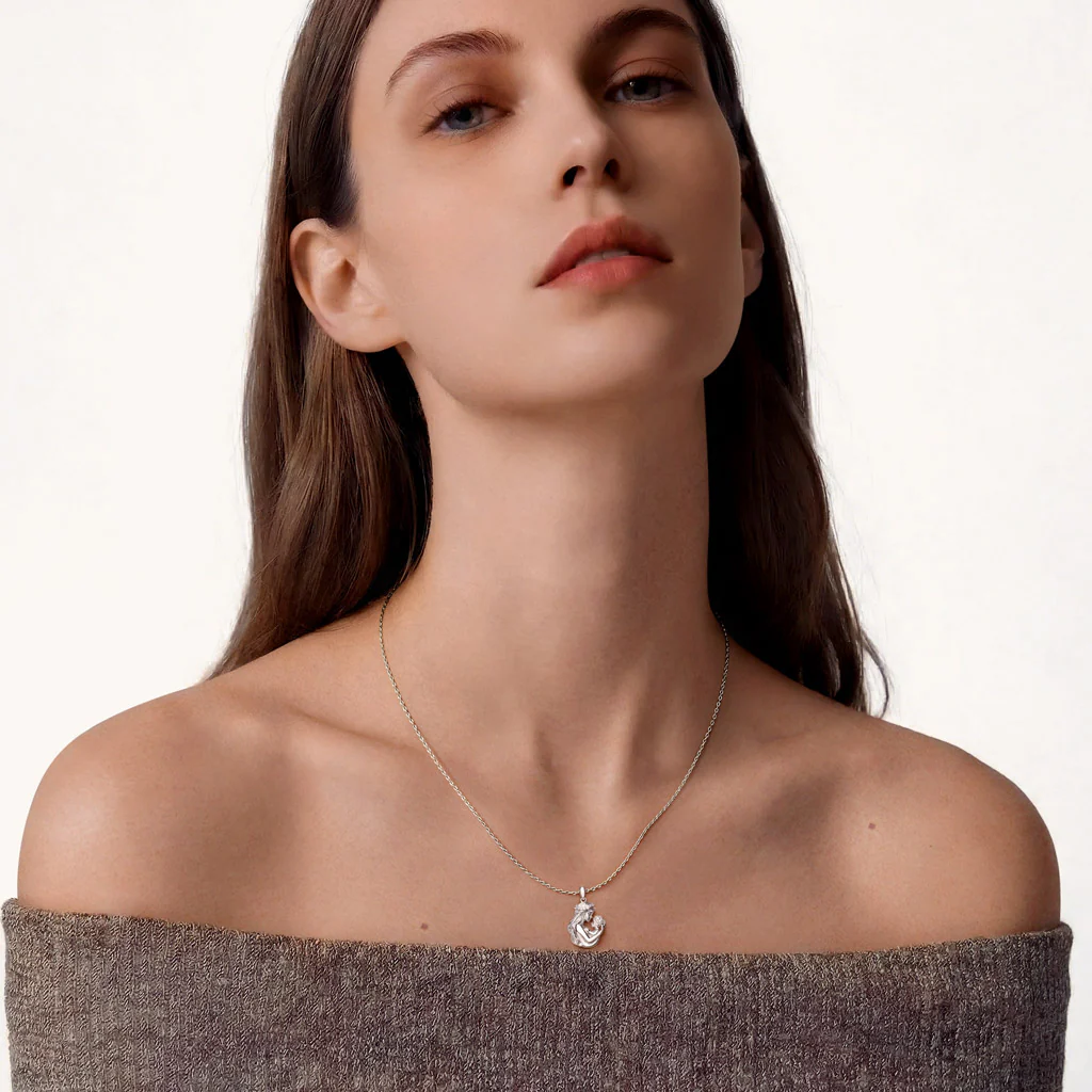 Gnoce  Mother Embraces Baby Pendant Necklace - Image 3